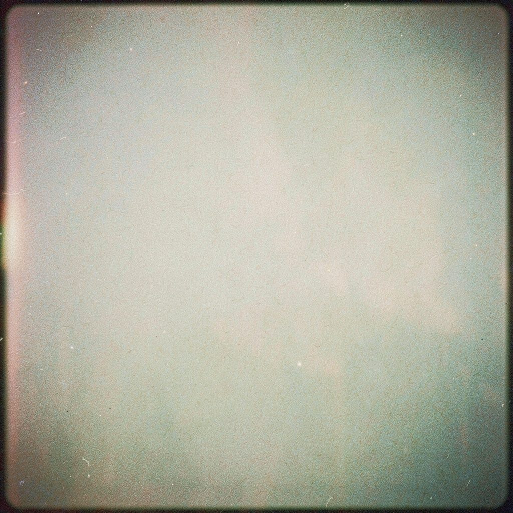 Soft grayscale library aisle photograph on analog film with visible grain, evoking scholarly archives.